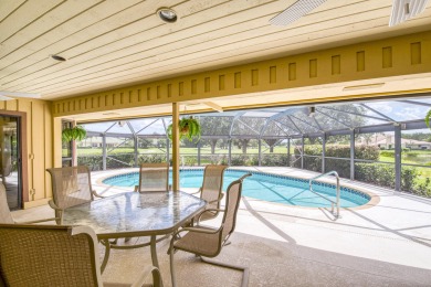 Discover sweeping golf course and lake views at this serene on Old Marsh Golf Club in Florida - for sale on GolfHomes.com, golf home, golf lot