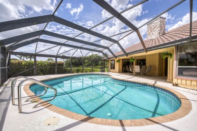 Discover sweeping golf course and lake views at this serene on Old Marsh Golf Club in Florida - for sale on GolfHomes.com, golf home, golf lot