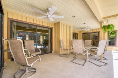 Discover sweeping golf course and lake views at this serene on Old Marsh Golf Club in Florida - for sale on GolfHomes.com, golf home, golf lot