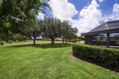 Discover sweeping golf course and lake views at this serene on Old Marsh Golf Club in Florida - for sale on GolfHomes.com, golf home, golf lot