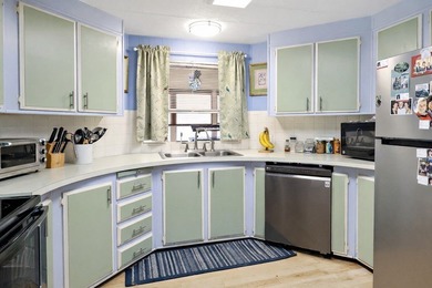 Live the vacation every single day in vibrant Barefoot Bay! This on Barefoot Bay Golf Course in Florida - for sale on GolfHomes.com, golf home, golf lot