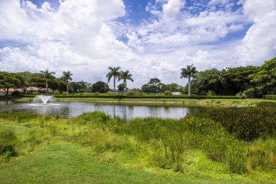 Discover sweeping golf course and lake views at this serene on Old Marsh Golf Club in Florida - for sale on GolfHomes.com, golf home, golf lot