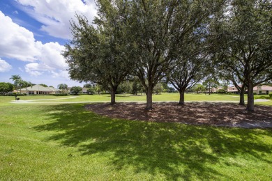 Discover sweeping golf course and lake views at this serene on Old Marsh Golf Club in Florida - for sale on GolfHomes.com, golf home, golf lot