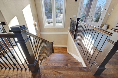 Stunning custom reverse 1.5-story home perfectly positioned on a on Loch Lloyd Country Club in Missouri - for sale on GolfHomes.com, golf home, golf lot