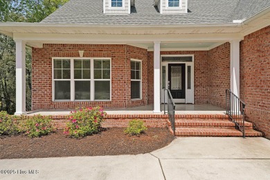 Quality & style combine with this home in Brunswick Forest. This on Cape Fear National At Brunswick Forest in North Carolina - for sale on GolfHomes.com, golf home, golf lot