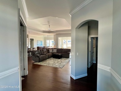 This exceptional residence is located within The Lakes at on Cape Fear National At Brunswick Forest in North Carolina - for sale on GolfHomes.com, golf home, golf lot