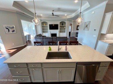 This exceptional residence is located within The Lakes at on Cape Fear National At Brunswick Forest in North Carolina - for sale on GolfHomes.com, golf home, golf lot