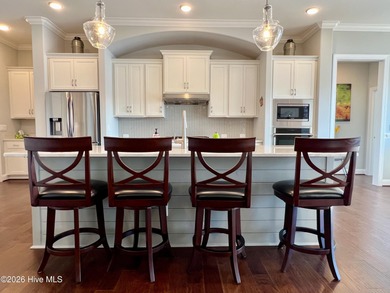 This exceptional residence is located within The Lakes at on Cape Fear National At Brunswick Forest in North Carolina - for sale on GolfHomes.com, golf home, golf lot