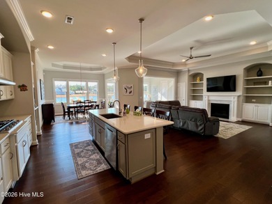 This exceptional residence is located within The Lakes at on Cape Fear National At Brunswick Forest in North Carolina - for sale on GolfHomes.com, golf home, golf lot