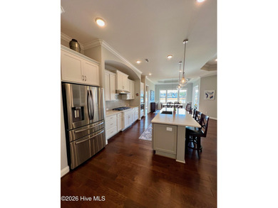 This exceptional residence is located within The Lakes at on Cape Fear National At Brunswick Forest in North Carolina - for sale on GolfHomes.com, golf home, golf lot