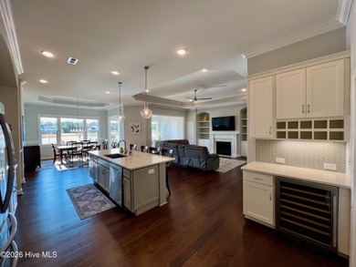 This exceptional residence is located within The Lakes at on Cape Fear National At Brunswick Forest in North Carolina - for sale on GolfHomes.com, golf home, golf lot