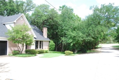 4 BR 2.5 bath home nestled on .55 acres (2 lots) surrounded by on White Bluff Resort - New Course in Texas - for sale on GolfHomes.com, golf home, golf lot