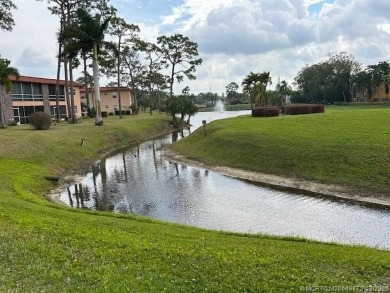 FIRST FLOOR CONDO WITH FANTASTIC VIEWS.   EAST SIDE OF PALM CITY on Monterey Yacht and Country Club in Florida - for sale on GolfHomes.com, golf home, golf lot