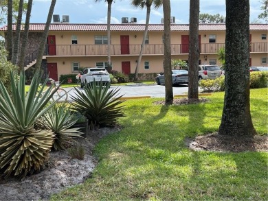 FIRST FLOOR CONDO WITH FANTASTIC VIEWS.   EAST SIDE OF PALM CITY on Monterey Yacht and Country Club in Florida - for sale on GolfHomes.com, golf home, golf lot