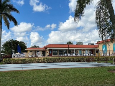 FIRST FLOOR CONDO WITH FANTASTIC VIEWS.   EAST SIDE OF PALM CITY on Monterey Yacht and Country Club in Florida - for sale on GolfHomes.com, golf home, golf lot