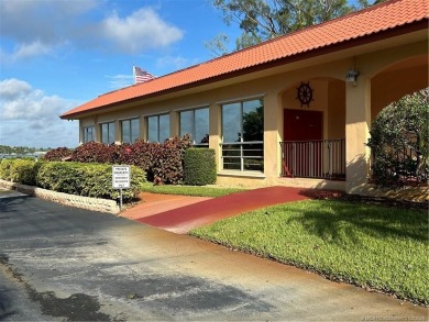 FIRST FLOOR CONDO WITH FANTASTIC VIEWS.   EAST SIDE OF PALM CITY on Monterey Yacht and Country Club in Florida - for sale on GolfHomes.com, golf home, golf lot