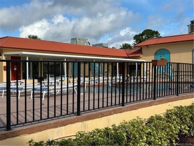 FIRST FLOOR CONDO WITH FANTASTIC VIEWS.   EAST SIDE OF PALM CITY on Monterey Yacht and Country Club in Florida - for sale on GolfHomes.com, golf home, golf lot