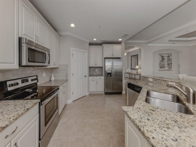 Come live the MAINTENANCE-FREE lifestyle in this beautifully on Venetian Golf and River Club in Florida - for sale on GolfHomes.com, golf home, golf lot