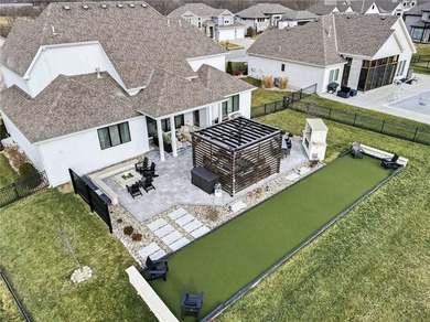 Built by Homes by Chris, this extraordinary 1.5-story home is a on Staley Farms Golf Club in Missouri - for sale on GolfHomes.com, golf home, golf lot