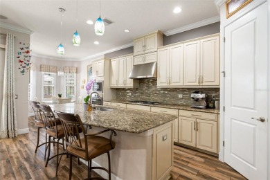 SPECTACULAR AND METICULOUSLY MAINTAINED THREE BEDROOM, DEN, 3 on Esplanade Golf and Country at Lakewood Ranch in Florida - for sale on GolfHomes.com, golf home, golf lot