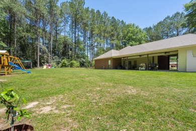 Welcome to your dream home in the serene Beaver Lake Subdivision on Pine Creek Golf Club in Mississippi - for sale on GolfHomes.com, golf home, golf lot