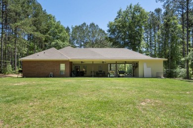 Welcome to your dream home in the serene Beaver Lake Subdivision on Pine Creek Golf Club in Mississippi - for sale on GolfHomes.com, golf home, golf lot