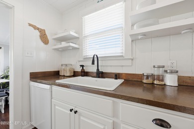 Just a 3-4 minutes walk to the ocean, this updated beach cottage on Jacksonville Beach Golf Course in Florida - for sale on GolfHomes.com, golf home, golf lot