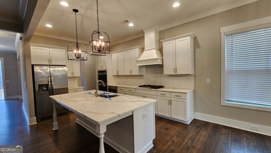 Welcome home to this beautifully refreshed 5-bedroom Craftsman on Traditions of Braselton Golf Club in Georgia - for sale on GolfHomes.com, golf home, golf lot