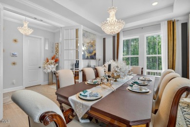 Situated atop a spacious corner lot in Hasentree, this on Hasentree Club in North Carolina - for sale on GolfHomes.com, golf home, golf lot