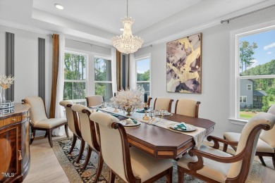 Situated atop a spacious corner lot in Hasentree, this on Hasentree Club in North Carolina - for sale on GolfHomes.com, golf home, golf lot