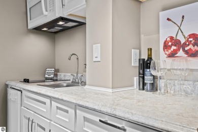 Absolutely stunning 1BR with views of East Bay from main living on  in Michigan - for sale on GolfHomes.com, golf home, golf lot