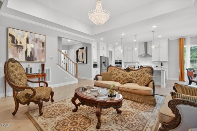 Situated atop a spacious corner lot in Hasentree, this on Hasentree Club in North Carolina - for sale on GolfHomes.com, golf home, golf lot