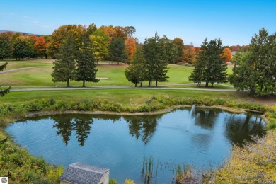Absolutely stunning 1BR with views of East Bay from main living on  in Michigan - for sale on GolfHomes.com, golf home, golf lot