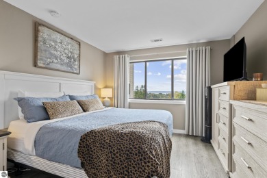 Absolutely stunning 1BR with views of East Bay from main living on  in Michigan - for sale on GolfHomes.com, golf home, golf lot
