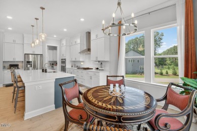 Situated atop a spacious corner lot in Hasentree, this on Hasentree Club in North Carolina - for sale on GolfHomes.com, golf home, golf lot