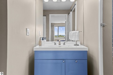 Absolutely stunning 1BR with views of East Bay from main living on  in Michigan - for sale on GolfHomes.com, golf home, golf lot