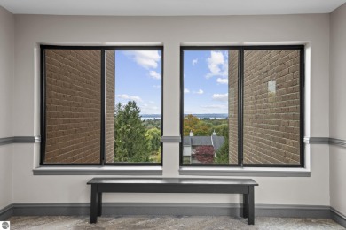 Absolutely stunning 1BR with views of East Bay from main living on  in Michigan - for sale on GolfHomes.com, golf home, golf lot