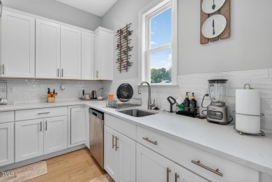 Situated atop a spacious corner lot in Hasentree, this on Hasentree Club in North Carolina - for sale on GolfHomes.com, golf home, golf lot