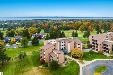 Absolutely stunning 1BR with views of East Bay from main living on  in Michigan - for sale on GolfHomes.com, golf home, golf lot