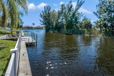 Welcome to this stunning waterfront residence in Cape Coral on Palmetto-Pine Country Club in Florida - for sale on GolfHomes.com, golf home, golf lot