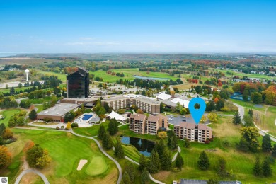 Absolutely stunning 1BR with views of East Bay from main living on  in Michigan - for sale on GolfHomes.com, golf home, golf lot
