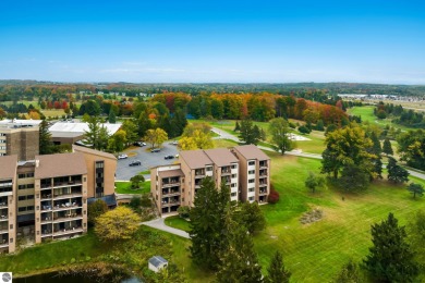 Absolutely stunning 1BR with views of East Bay from main living on  in Michigan - for sale on GolfHomes.com, golf home, golf lot
