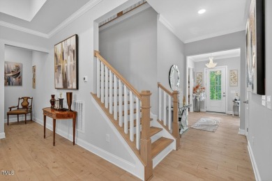 Situated atop a spacious corner lot in Hasentree, this on Hasentree Club in North Carolina - for sale on GolfHomes.com, golf home, golf lot