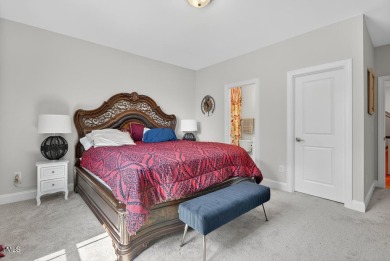Situated atop a spacious corner lot in Hasentree, this on Hasentree Club in North Carolina - for sale on GolfHomes.com, golf home, golf lot