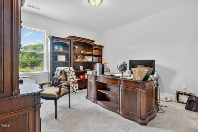 Situated atop a spacious corner lot in Hasentree, this on Hasentree Club in North Carolina - for sale on GolfHomes.com, golf home, golf lot