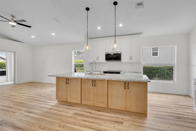 Welcome to this beautifully updated home in the sought-after on Kings Ridge Golf Club in Florida - for sale on GolfHomes.com, golf home, golf lot