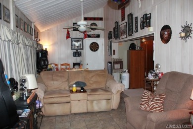 Check out this fully furnished 1994 camper with addition built on River Ridge Golf Club in Virginia - for sale on GolfHomes.com, golf home, golf lot