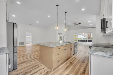 Welcome to this beautifully updated home in the sought-after on Kings Ridge Golf Club in Florida - for sale on GolfHomes.com, golf home, golf lot