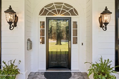 This exceptional home blends timeless Southern charm with on Lockwood Folly Country Club in North Carolina - for sale on GolfHomes.com, golf home, golf lot