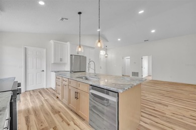 Welcome to this beautifully updated home in the sought-after on Kings Ridge Golf Club in Florida - for sale on GolfHomes.com, golf home, golf lot